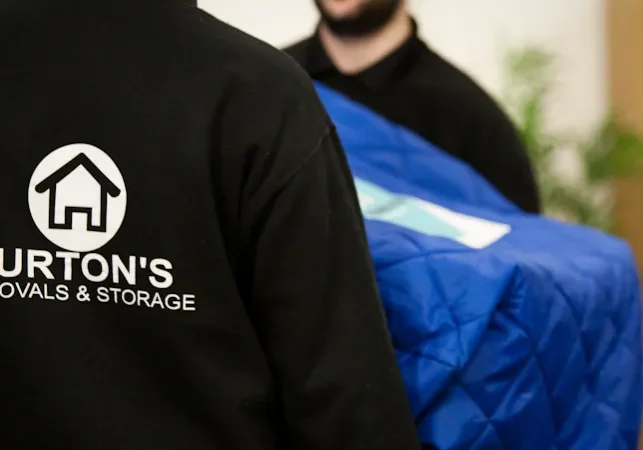 Turton's crew wrapping furniture in a Newcastle home before a move to Switzerland